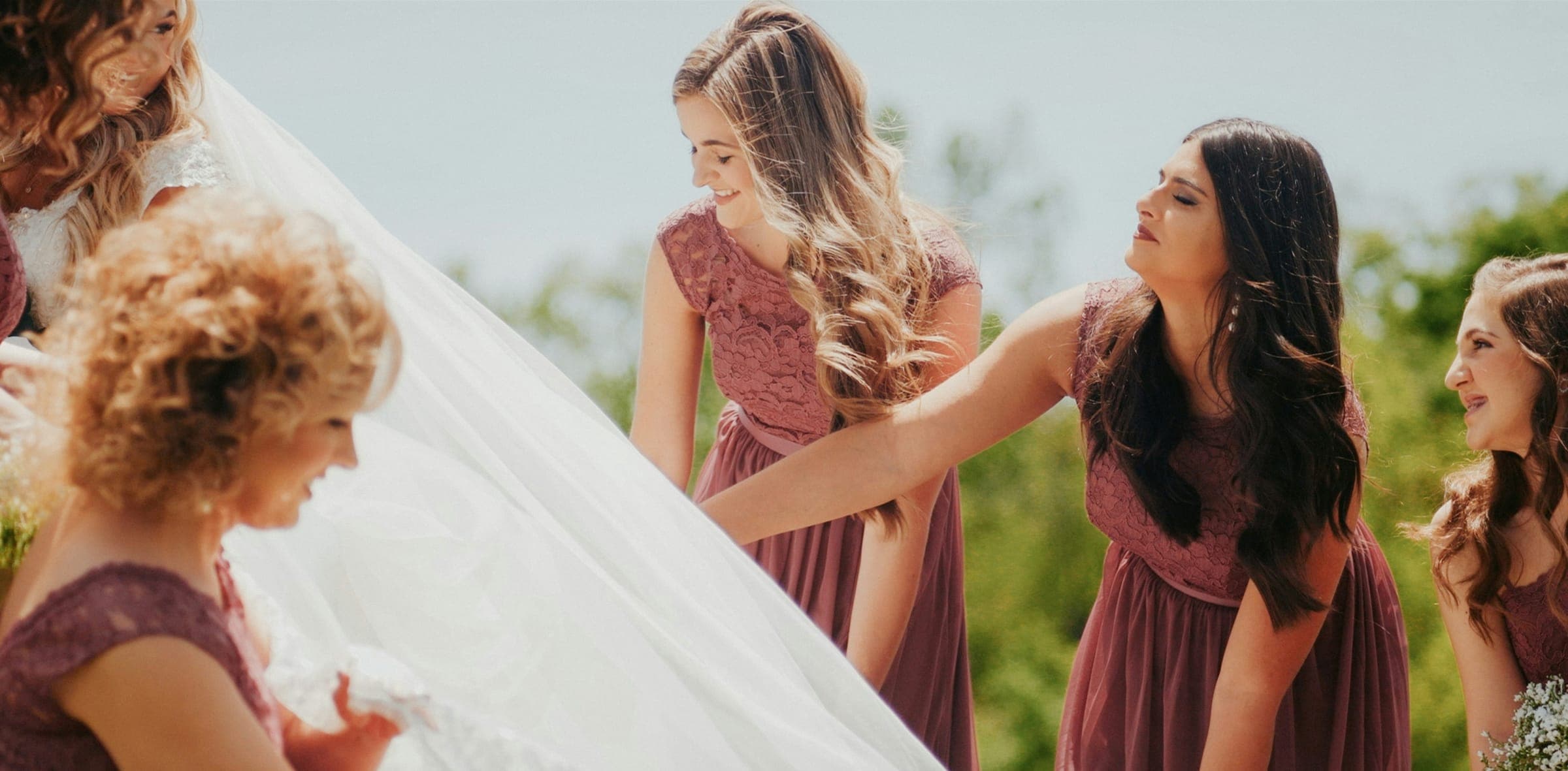 A couple with their wedding party on the wedding day